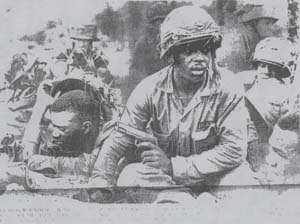 Source: The Faces of War: Looking for Trouble [Photograph with Caption.] New York Amsterdam News, February 5, 1966, p. 1.